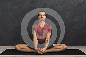 Young man practicing yoga, relax meditation pose