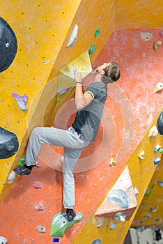 Young man practising climbing