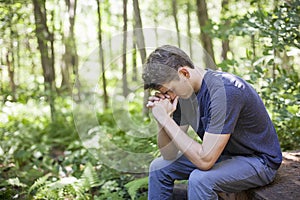 Young man in prayer photo