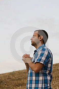 Young man praying.