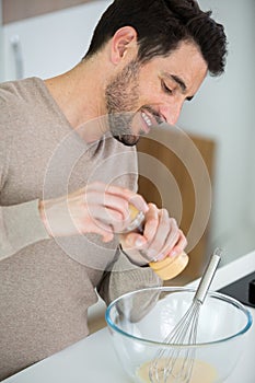 young man preparing all ingredient to do dessert