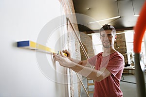 Young man doing apartment repair hisselfes