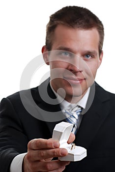 Young man presenting engagement ring