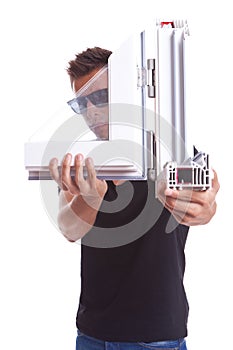 Young man presenting a pvc window sample photo