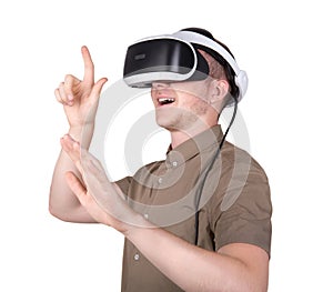 A young man with professional audio equipment, isolated on a white background. Surprised guy with VR goggles.