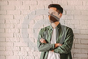 Young man in professional respirator for personal protection