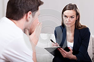 Young man during psychotherapy photo