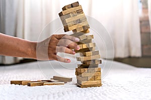 Young man pulling out wood block fail