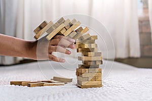 Young man pulling out wood block fail