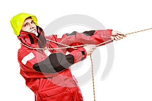 Young man pulling rope.