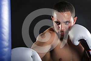 Young Man Punching Bag