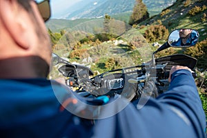 Young man on quad bike on a countryside trail. View from a quad bike.