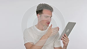 Young Man Reacting to Loss on Tablet on White Background