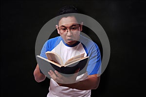 Young Man Reading Book