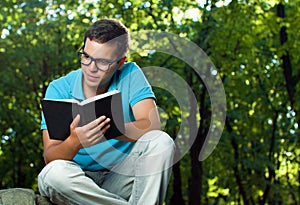 Young man reading book