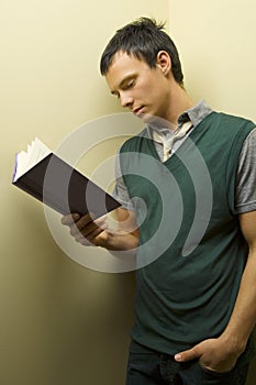 Young man reading book