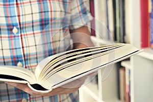 Young man reading a book