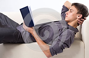 Young man reading book