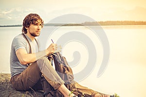 Young Man reading book outdoor