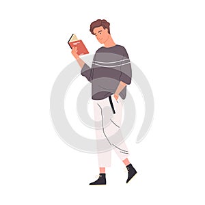 Young man reading book while walking or strolling. Cute male reader or student enjoying literature or preparing for exam