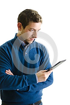 Young man reading ebook reader, isolated