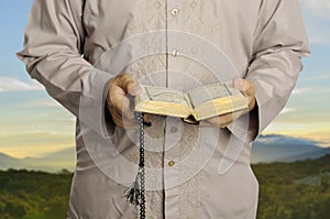 Young Man Reading The Holy Koran