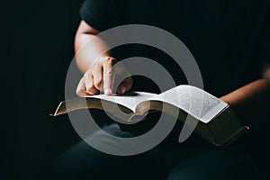 Young man reading and study holy bible