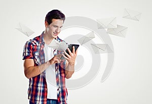 Young man receive mail over tablet photo