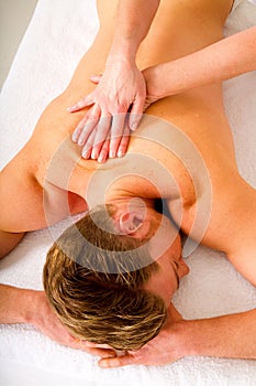 Young man receives to the shoulders