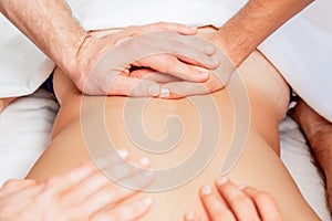 Young man receiving back massage