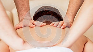 Young man receiving back massage