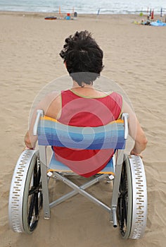 Young man with red tshirt on the wheelchair