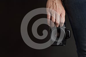 Young man with a reflex camera