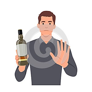 Young man refuse drinking alcohol. Decisive male make hand gesture sign say stop no to alcoholic cocktail. Guy reject beverage at