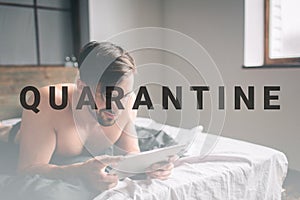 Young man relaxation on the bed and using digital tablet