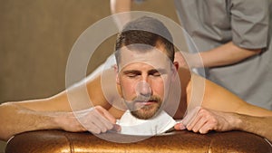 Young man relaxing back massage