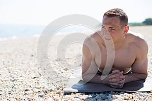 Young man relaxing at the beach