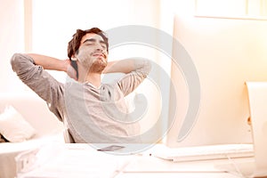 Young man relaxing during a break at the office