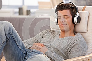Young man relaxing with headphones photo