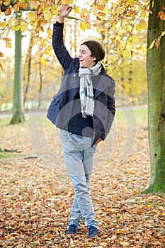 Young man relaxing outdoors on an Autumn day