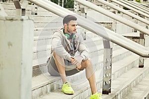 Young man relaxing in between workouts