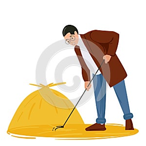 A young man removes the hay with a rake