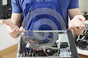 Young man repairing computer