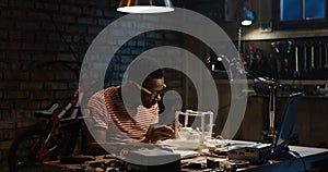 Young man repairing a drone
