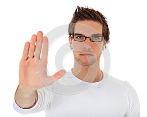 Young man with repelling gesture