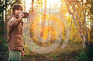 Young Man with retro photo camera outdoor