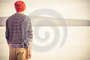 Young Man with retro photo camera outdoor