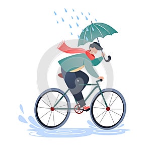 Young man rides a bicycle and holds an umbrella, walk in the fresh air, physical activity