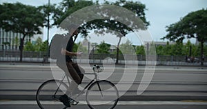 Young man rides commuter bicycle in the city