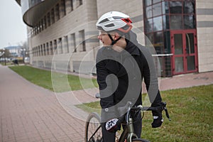 Young man riding bicycle in winter